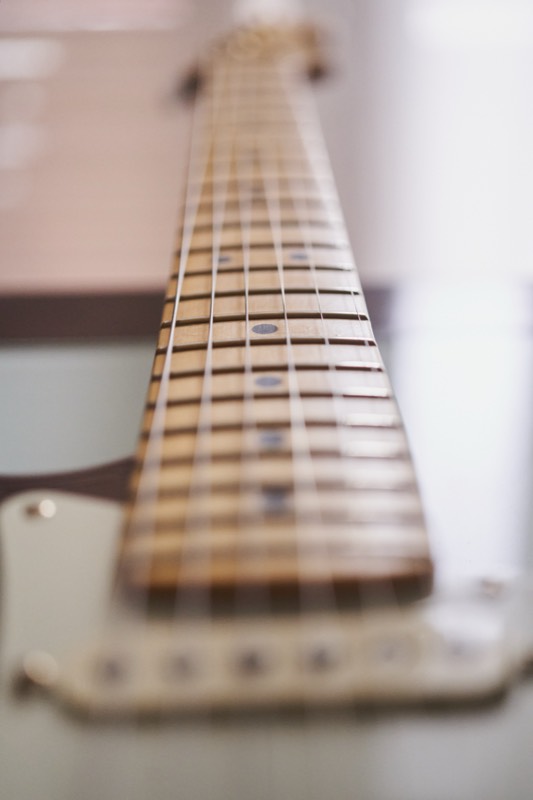 Close-up of electric guitar fretboard