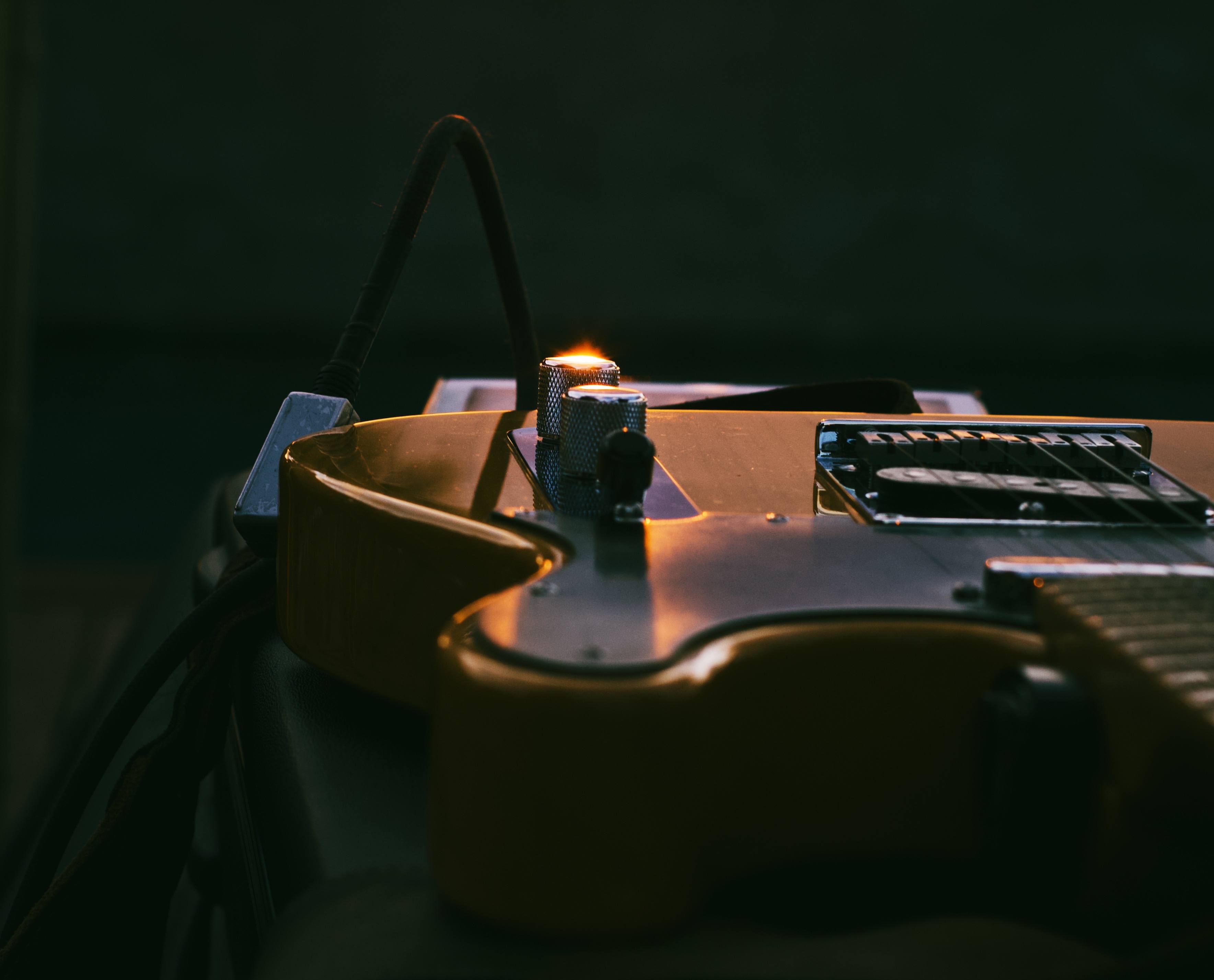 Electric guitar body close-up in moody lighting
